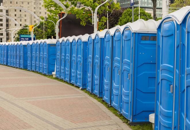 a line of portable restrooms at a sporting event, providing athletes and spectators with clean and accessible facilities in Bantam